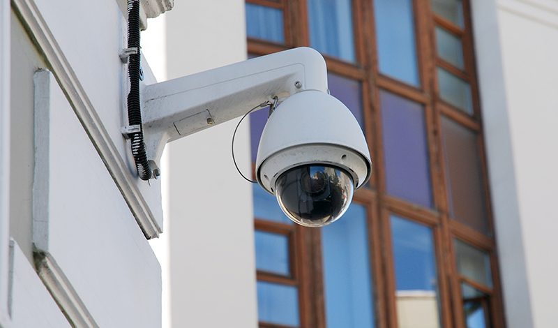 Spherical external surveillance camera on building facade