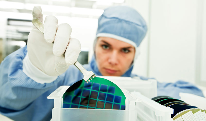 Woman in scrubs cleaning a thin film